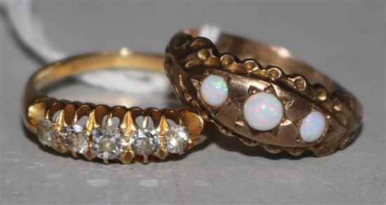An early 20th century 18ct gold and graduated five stone diamond half hoop ring and a similar 9ct gold and opal ring.